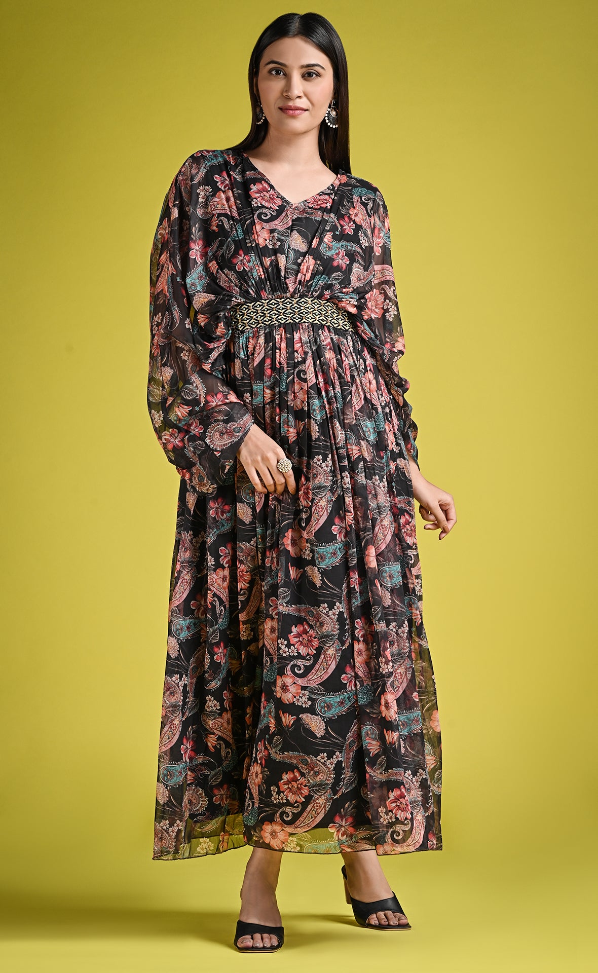 Floral printed black gown with ruffle sleeve and fitted belt