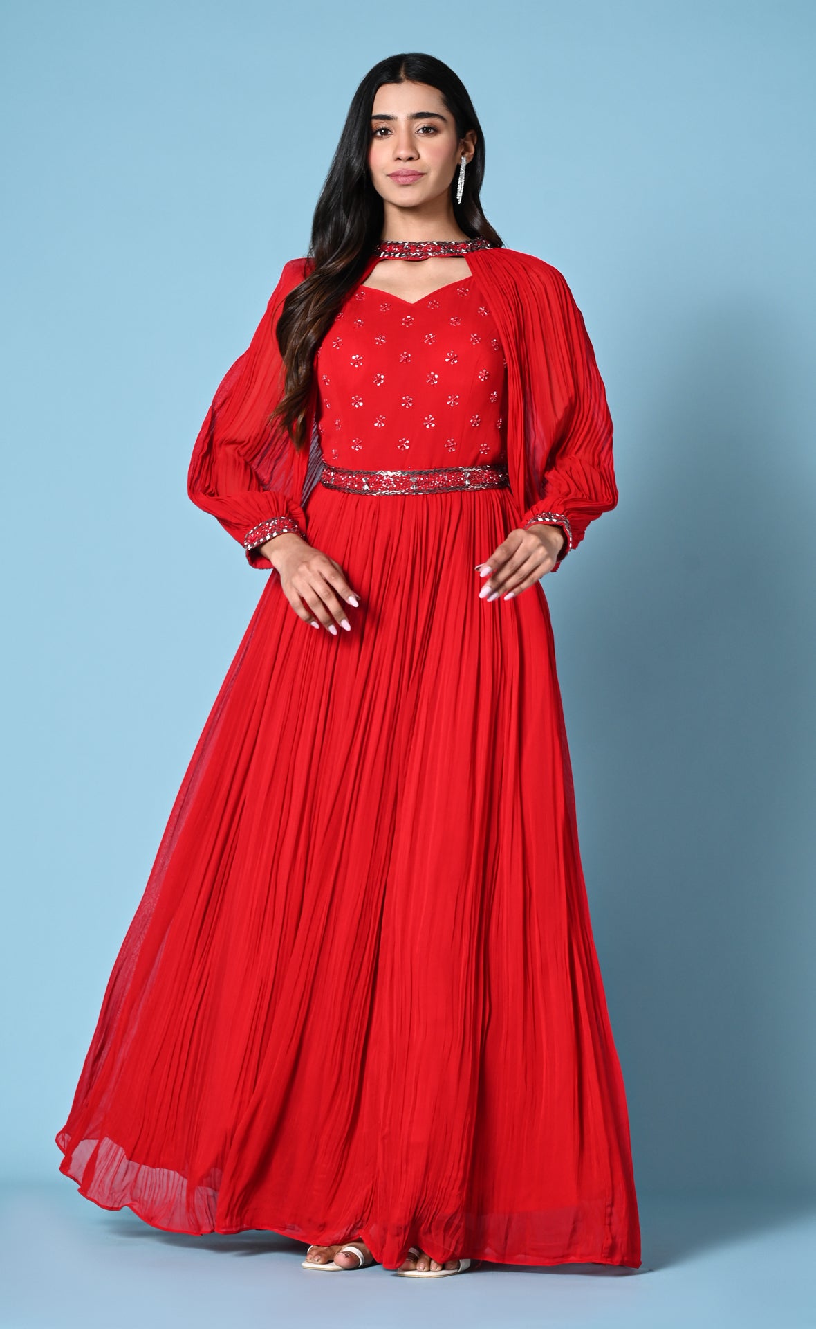 Red cocktail gown with statement sleeve and hip belt