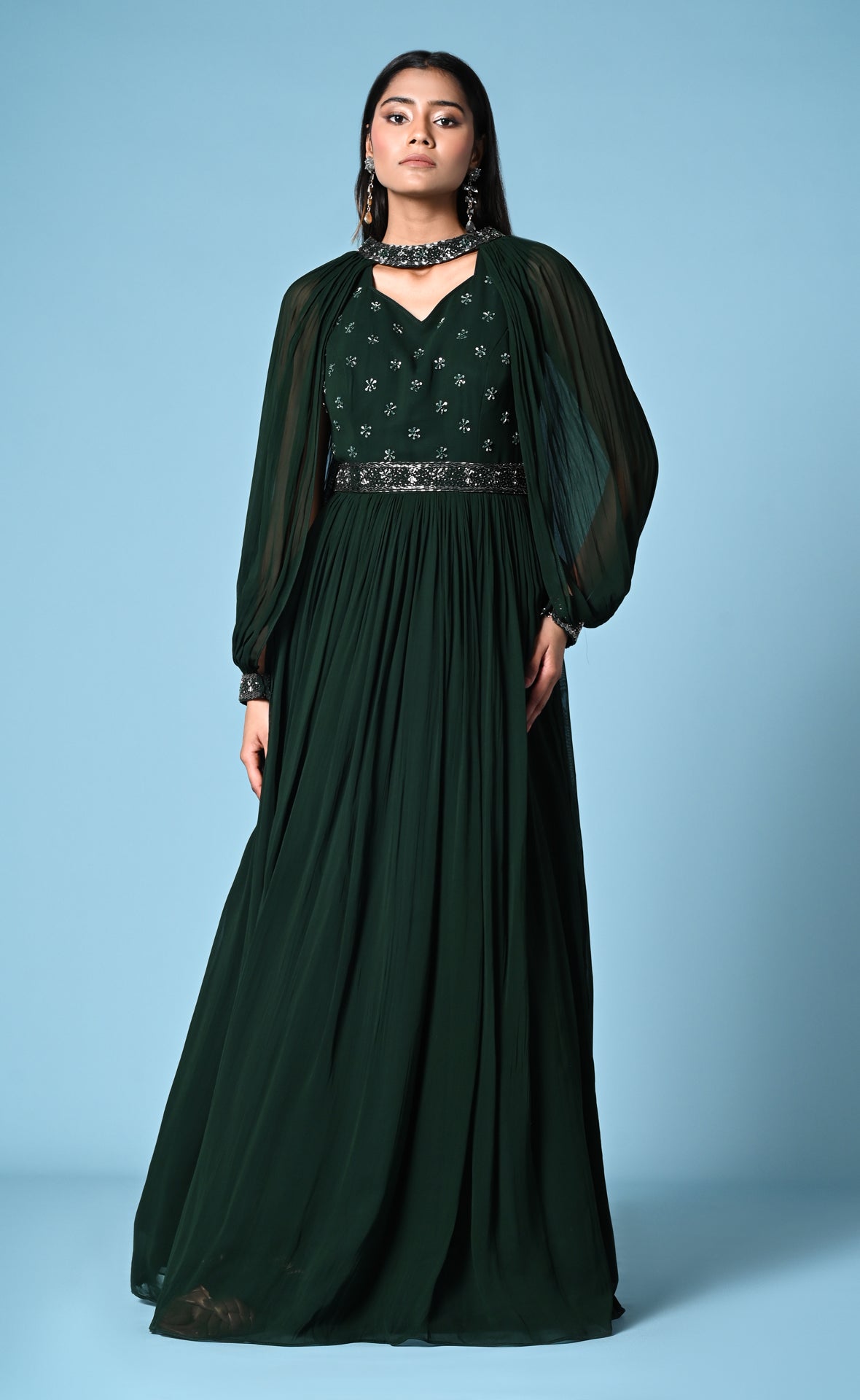 Green cocktail gown with statement sleeve and hip belt