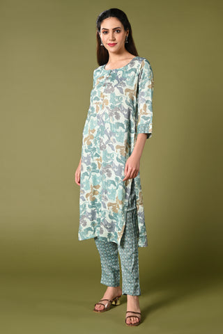 Blue floral printed daily wear rayon kurti set with 3/4 sleeves roundneck single side pocket and straight pants.
•	Floral prints all over the kurti set.
•	Round neck,3/4 sleeves & single side pocket.
•	Double sided elastic straight fit pants.
•	All day comfort rayon material.
•	Blue colour with floral prints will give a stylish and vibrant look.
