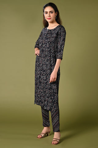 Geometrical printed navy-blue daily wear kurti set with 3/4 sleeves roundneck single side pocket and straight pants.
•	Geometrical prints all over the kurti set.
•	Round neck, 3/4 sleeves & single side pocket.
•	Double sided elastic straight fit pants.
•	All day comfort rayon material.
