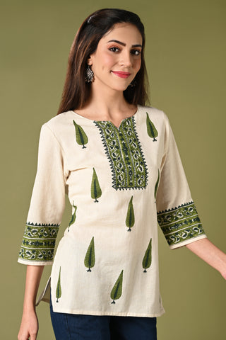 Half white short cotton flex summer kurthi for jean with green leaf prints.
•	Straight short cotton kurti with leaf prints all over.
•	Mild thread work in neck ,3/4 sleeves.
•	 Cotton flex material.
