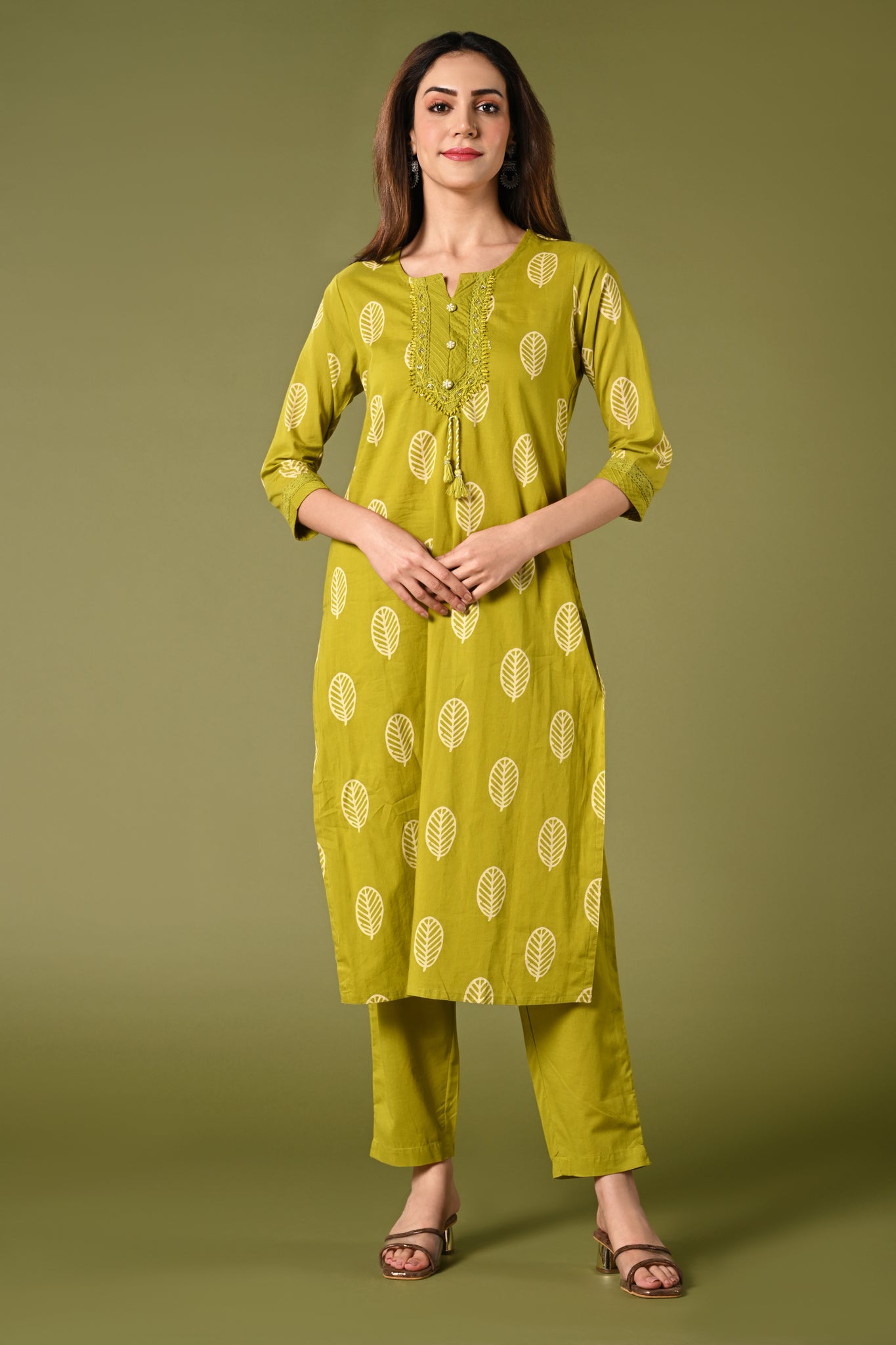 Parrot green printed cotton daily wear kurti set with thread work straight pant and cotton mul dupatta.
•	Leaf prints all over the body.
•	Round neck & 3/4 sleeves.
•	Single sided elastic and comfortable straight pants.
•	Pure cotton material.
•	Cotton mul dupatta.
