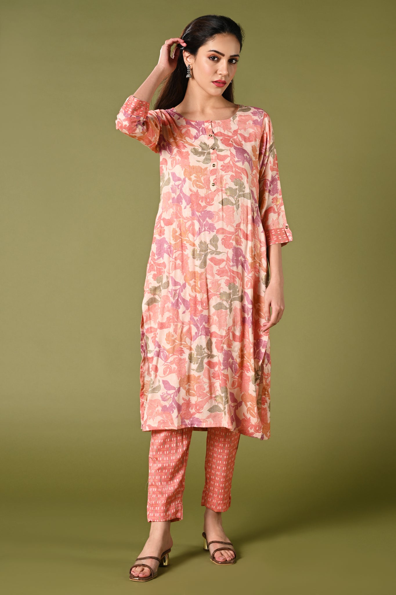 Peach floral printed daily wear rayon kurti set with 3/4 sleeves roundneck single side pocket and straight pants.
•	Floral prints all over the kurti set.
•	Round neck, 3/4 sleeves & single side pocket.
•	Double sided elastic straight fit pants.
•	All day comfort rayon material.
•	Peach colour with floral prints will give a warm look with the touch of freshness and elegance.
