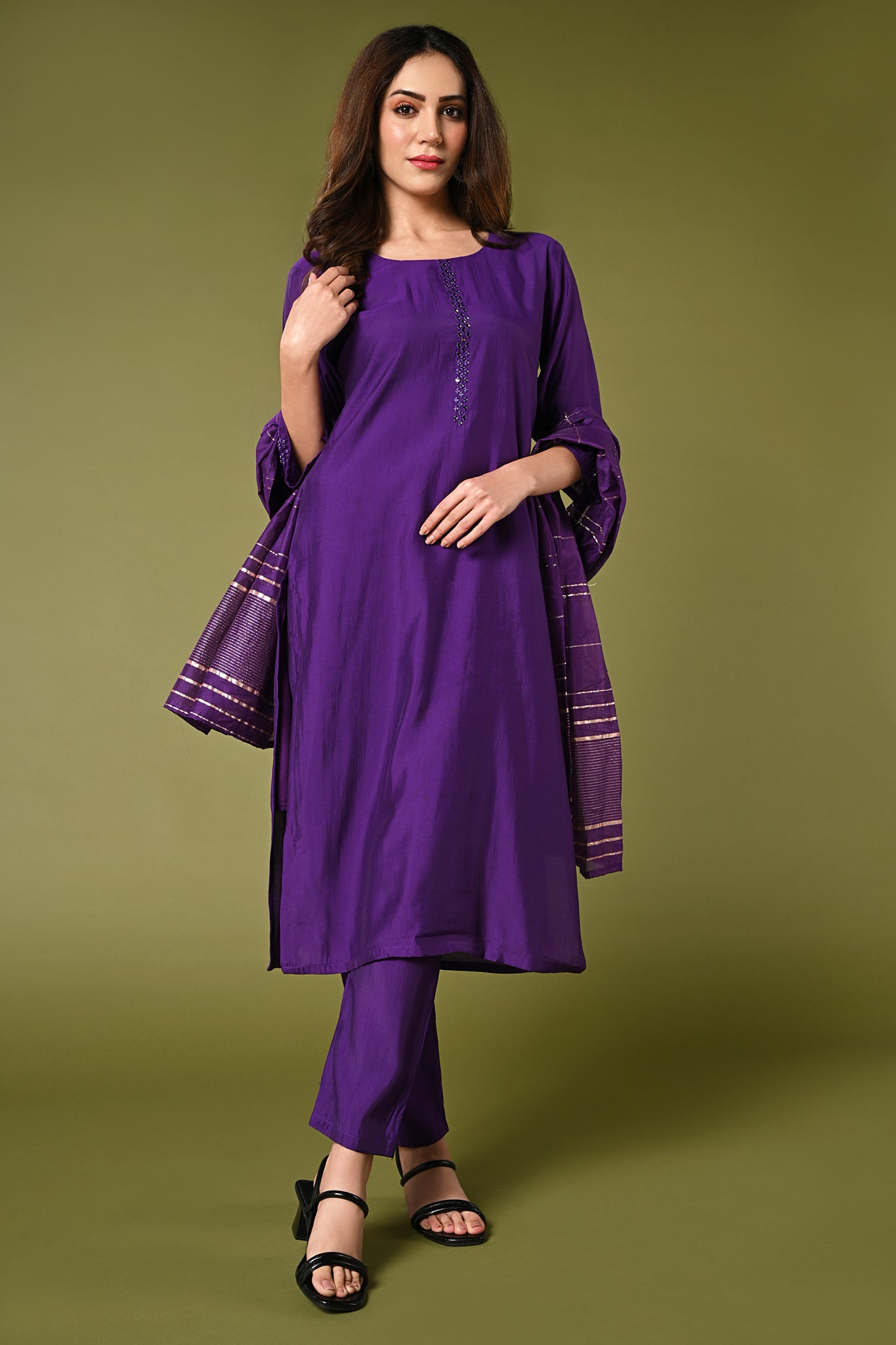 Plain purple mirror worked straight cut set with zari woven dupatta and straight pants.
•	Plain top with mirror-work in neckline and back neck.
•	3/4 sleeves with mirror and thread work in border.
•	Single side elastic comfortable straight pants.
•	Matching purple zari woven dupatta.
•	Chanderi material.
