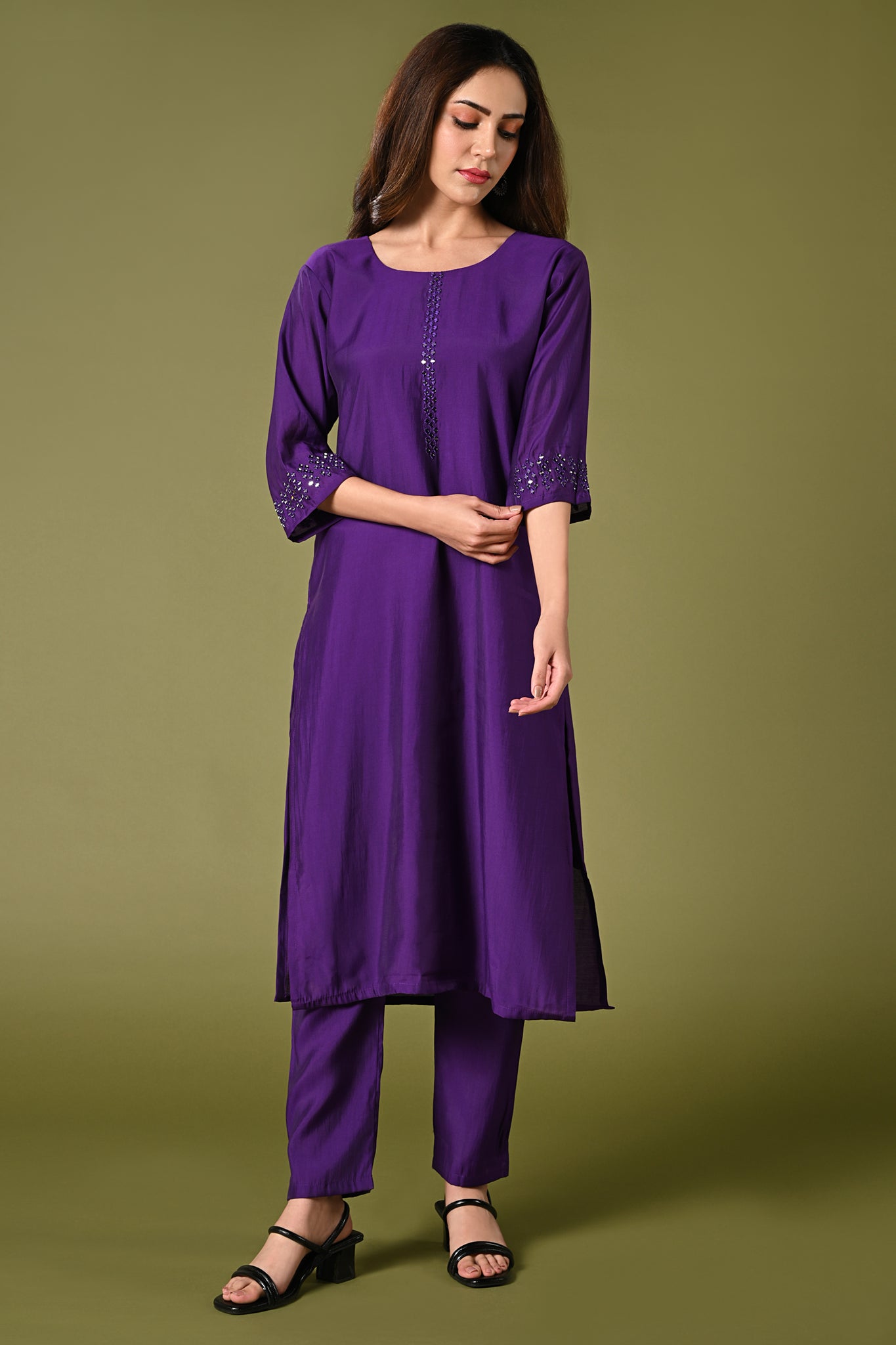 Plain purple mirror worked straight cut set with zari woven dupatta and straight pants.
•	Plain top with mirror-work in neckline and back neck.
•	3/4 sleeves with mirror and thread work in border.
•	Single side elastic comfortable straight pants.
•	Matching purple zari woven dupatta.
•	Chanderi material.
