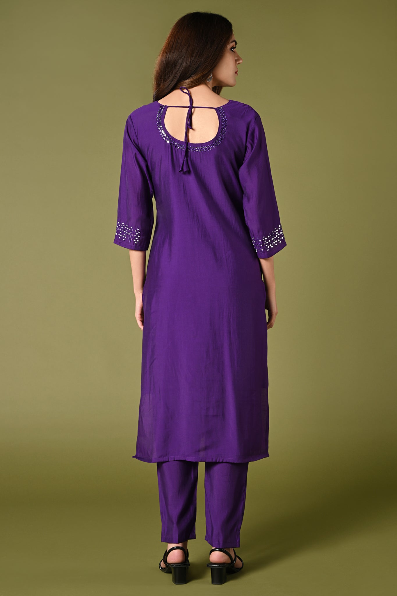 Plain purple mirror worked straight cut set with zari woven dupatta and straight pants.
•	Plain top with mirror-work in neckline and back neck.
•	3/4 sleeves with mirror and thread work in border.
•	Single side elastic comfortable straight pants.
•	Matching purple zari woven dupatta.
•	Chanderi material.
