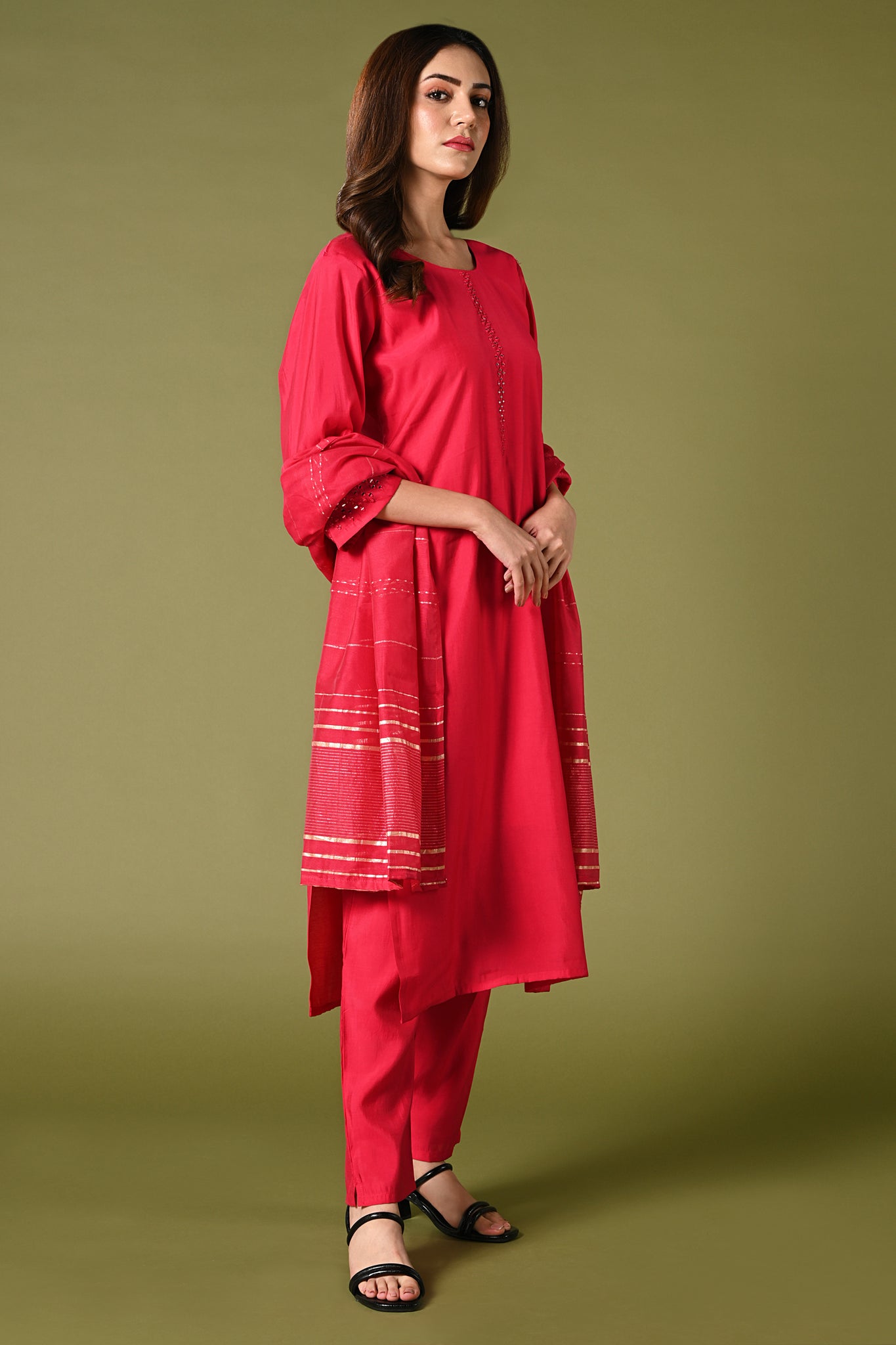 Plain rani pink mirror worked straight cut set with zari woven dupatta and straight pants.
•	Plain top with mirror-work in neckline and back neck.
•	3/4 sleeves with mirror and thread work in border.
•	Single side elastic comfortable straight pants.
•	Matching pink zari woven dupatta
•	Chanderi material.
