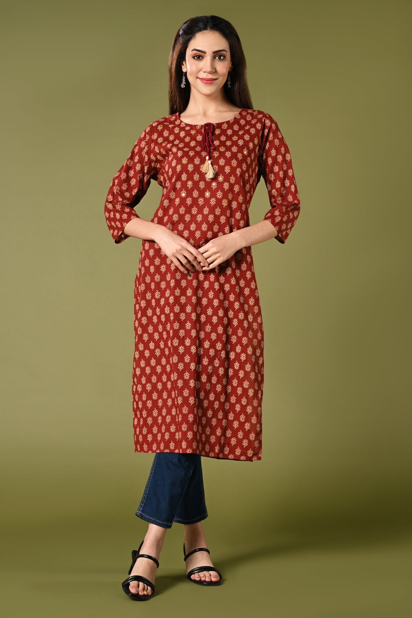 Printed maroon daily wear straight cotton kurti with mirror and thread work.
•	Straight kurti with prints all over.
•	3/4 sleeves, round neck with rope.
•	Mirror and thread work in the neck.
•	Pure cotton material.
