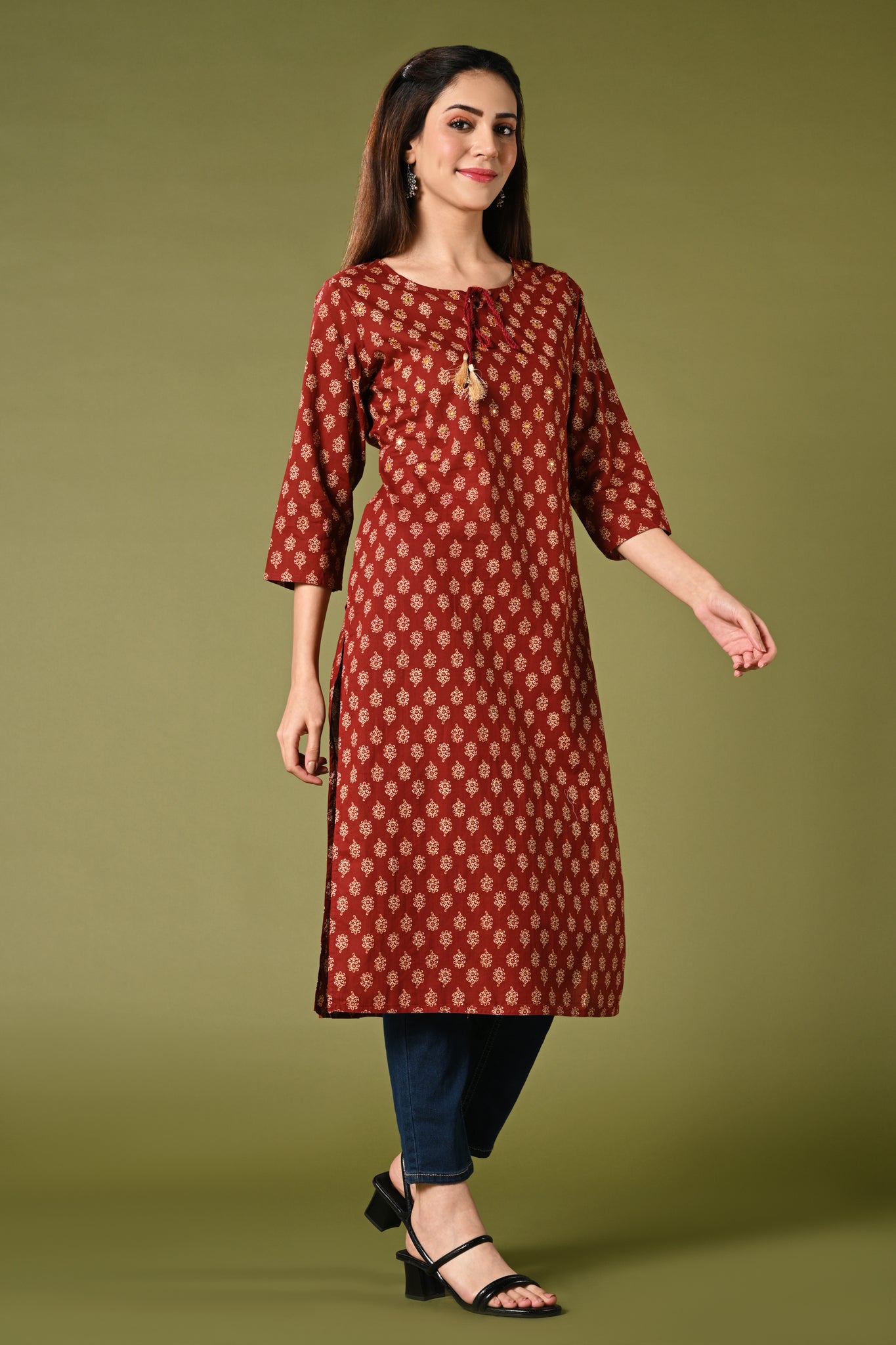 Printed maroon daily wear straight cotton kurti with mirror and thread work.
•	Straight kurti with prints all over.
•	3/4 sleeves, round neck with rope.
•	Mirror and thread work in the neck.
•	Pure cotton material.
