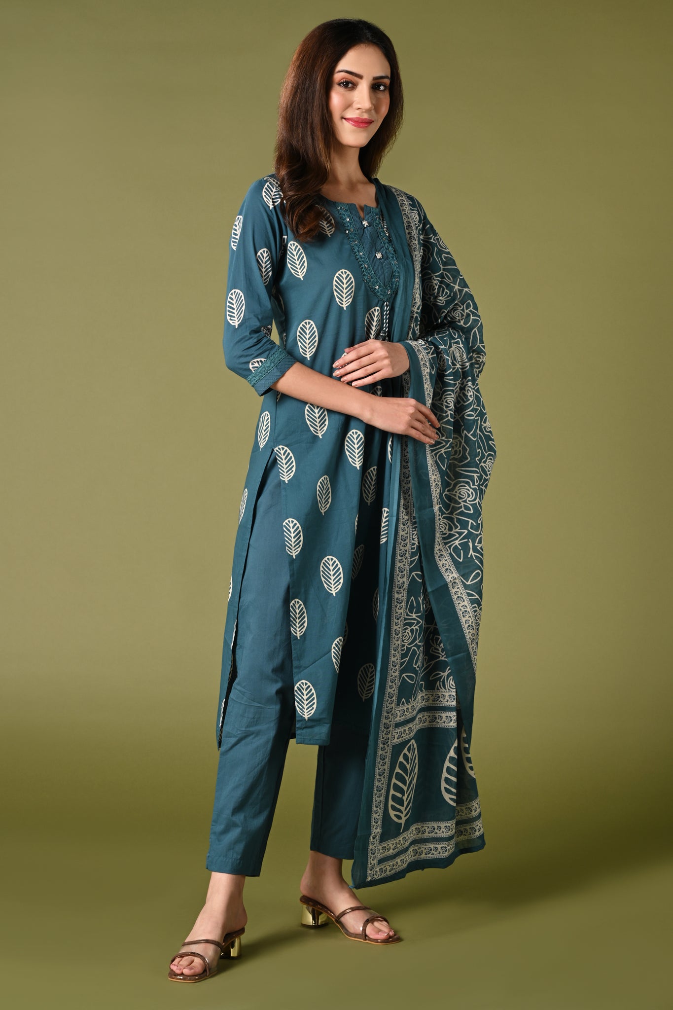 Rama blue leaf printed cotton daily wear kurti set with thread work straight pant and cotton mul dupatta.
•	Leaf prints all over the body.
•	Round neck & 3/4 sleeves.
•	Single sided elastic and comfortable straight pants.
•	Pure cotton material.
•	Cotton mul dupatta.
