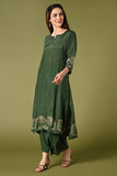 Solid green muslin kurti set with elephant print in border and sleeves.
•	Plain colour kurti with elephant prints in border and sleeve.
•	Round neck & 3/4 sleeves.
•	Double sided elastic and comfortable straight fit pants.
•	The green colour muslin with elephant prints will give a perfect occasional vibe.
