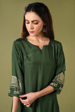 Solid green muslin kurti set with elephant print in border and sleeves.
•	Plain colour kurti with elephant prints in border and sleeve.
•	Round neck & 3/4 sleeves.
•	Double sided elastic and comfortable straight fit pants.
•	The green colour muslin with elephant prints will give a perfect occasional vibe.
