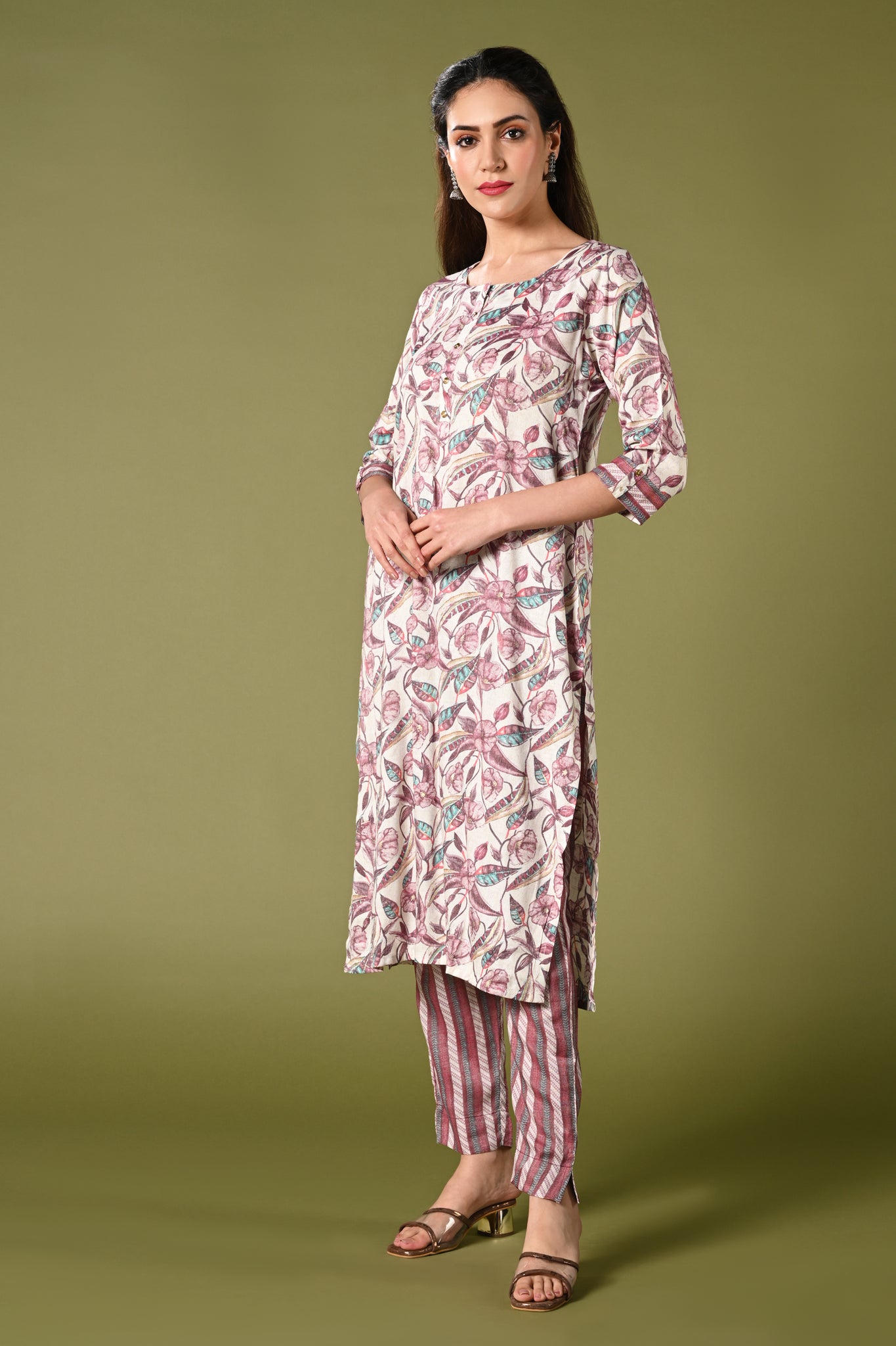 White and pink floral printed rayon daily wear kurti set with 3/4 sleeves roundneck single side pocket and straight pants.
•	Floral prints all over the kurti set
•	Round neck, 3/4 sleeves & single side pocket.
•	Double sided elastic straight fit pants.
•	All day comfort rayon material.
•	White and pink with floral prints will give a balanced and harmonious look.
