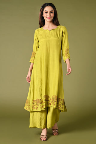 solid lime green muslin kurti set with elephant print in border and sleeves.
•	Plain color kurti with elephant prints in border and sleeve.
•	Round neck & 3/4 sleeves.
•	Double sided elastic and comfortable straight fit pants.
•	The lime green color muslin with elephant prints will give a fresh whimsical vibe.
