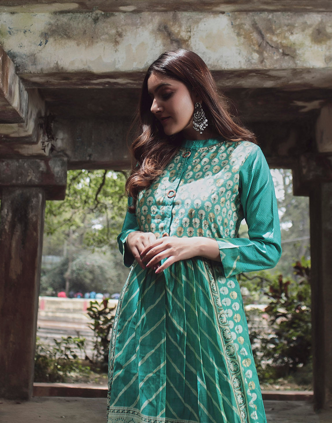Elegant turquoise blue kurthi with floral print and stripes